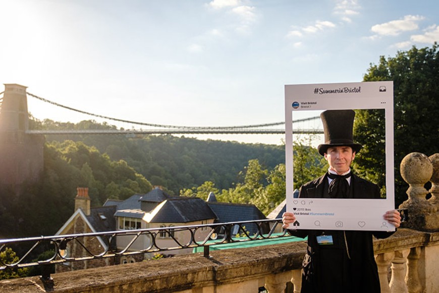 Mr Brunel in Visit Bristol Instagram frame in front of Clifton Suspension Bridge
